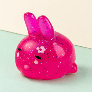 Bunny squishy mochi – Mochi Squishy Bunny with Glitter, product photo on pastel paper