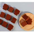 Bear sponge and toast shaped sponges, some on a wooden plate