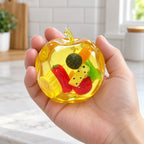 Apple Squishy with Fruit Inside, Slow Rising, held in a hand to show the real size