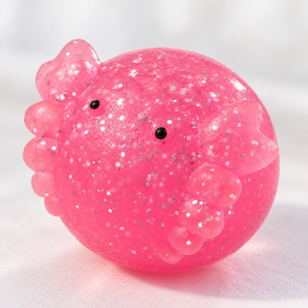 Axolotl Mochi Squishy with Glitter, close-up of the glitter