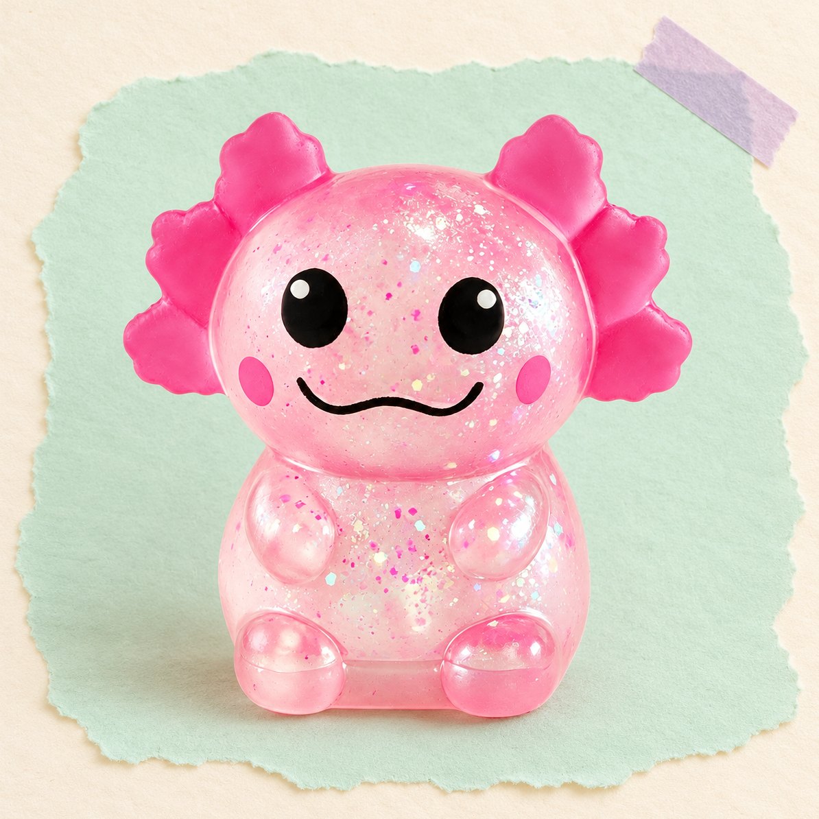 Lyserød glimmer-axolotl-squishy, produktfoto på pastelfarvet papir