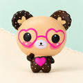 Bear squishy with heart glasses slow rising – Bear Squishy with Heart Glasses, Slow Rising, 12 cm (Beige), product photo on pastel paper