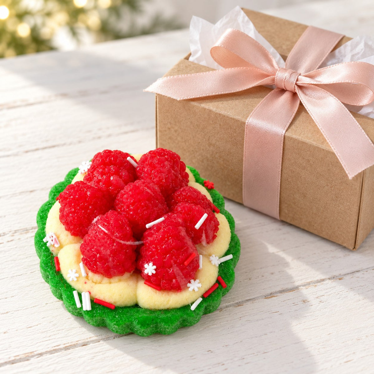 Berry tart squishy, as a small gift next to a wrapped box