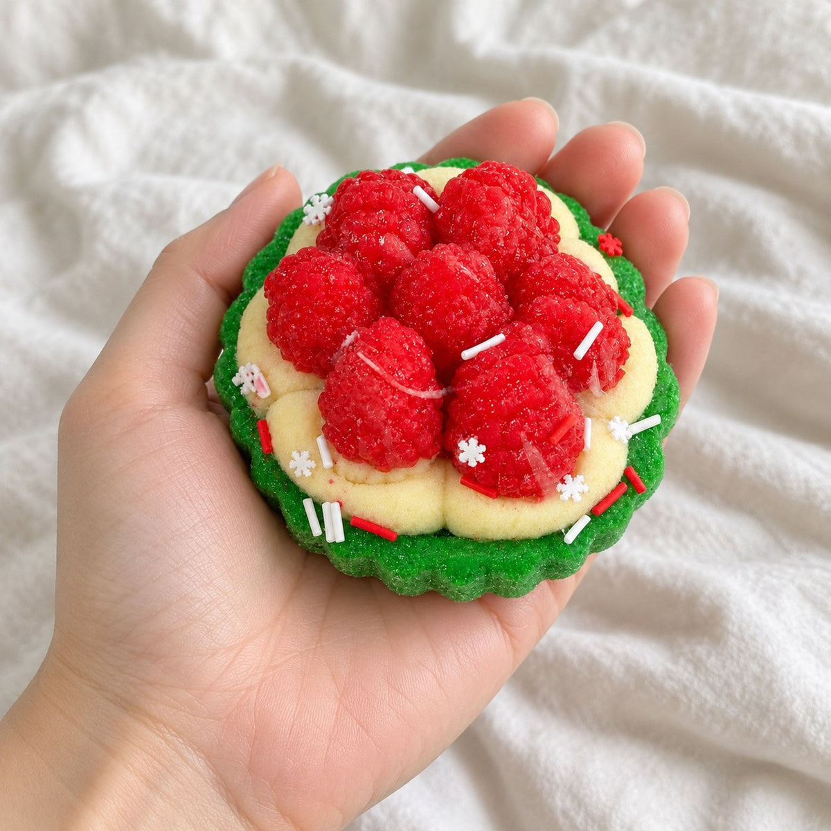 Berry tart squishy, held toward the camera, first-person view