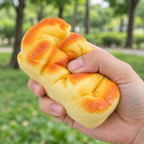 Bread Loaf Squishy, Brioche Style 11 or 15 cm (11 cm), being squeezed by hand, soft and squishy