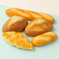 Bread loaf squishy set slow rising – Bread Loaf Squishy Set of 5, product photo on pastel paper