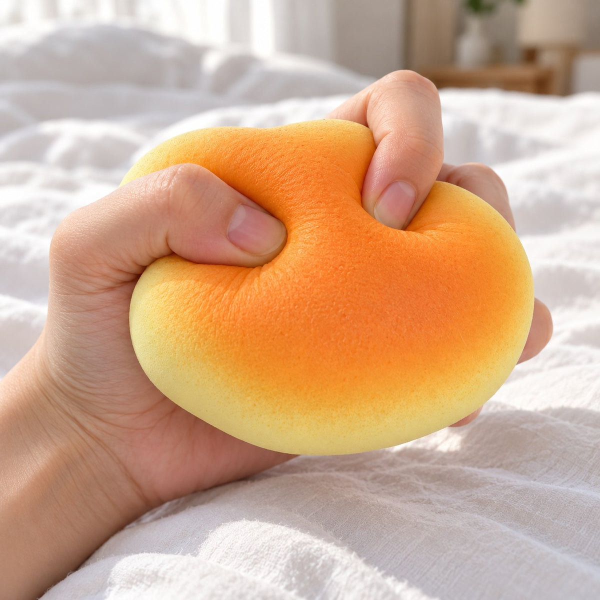 Bun squishy soft, being squeezed by hand, soft and squishy