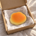 Bun squishy soft, unboxed from a parcel with tissue paper
