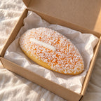 Bun squishy slow rising jumbo (12 cm), unboxed from a parcel with tissue paper