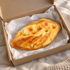 Flatbread squishy slow rising, unboxed from a parcel with tissue paper