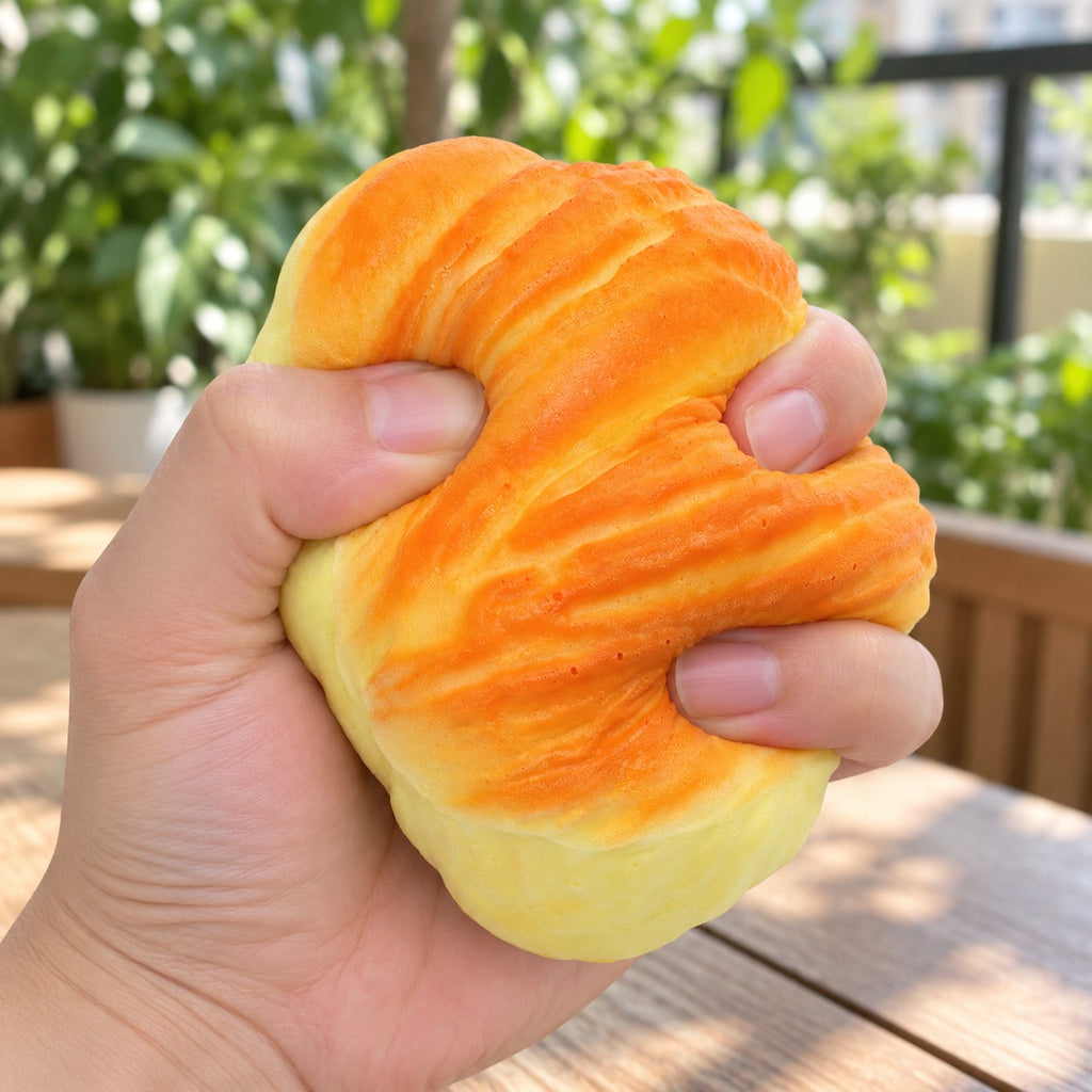 Flaky pastry squishy, being squeezed by hand, soft and squishy