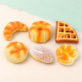 Bread squishy slow rising – Bakery Squishy Box of 6, product photo on pastel paper