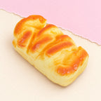 Squishy pão de forma – Squishy pão de forma, estilo brioche 11 ou 15 cm (11 cm), fotografia do produto em papel pastel