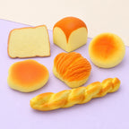Bun squishy set slow rising – Bread Basket Squishy Set of 6, product photo on pastel paper