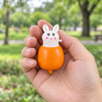Bunny Pop-Up Squishy, Rabbit in a Carrot, held in a hand to show the real size