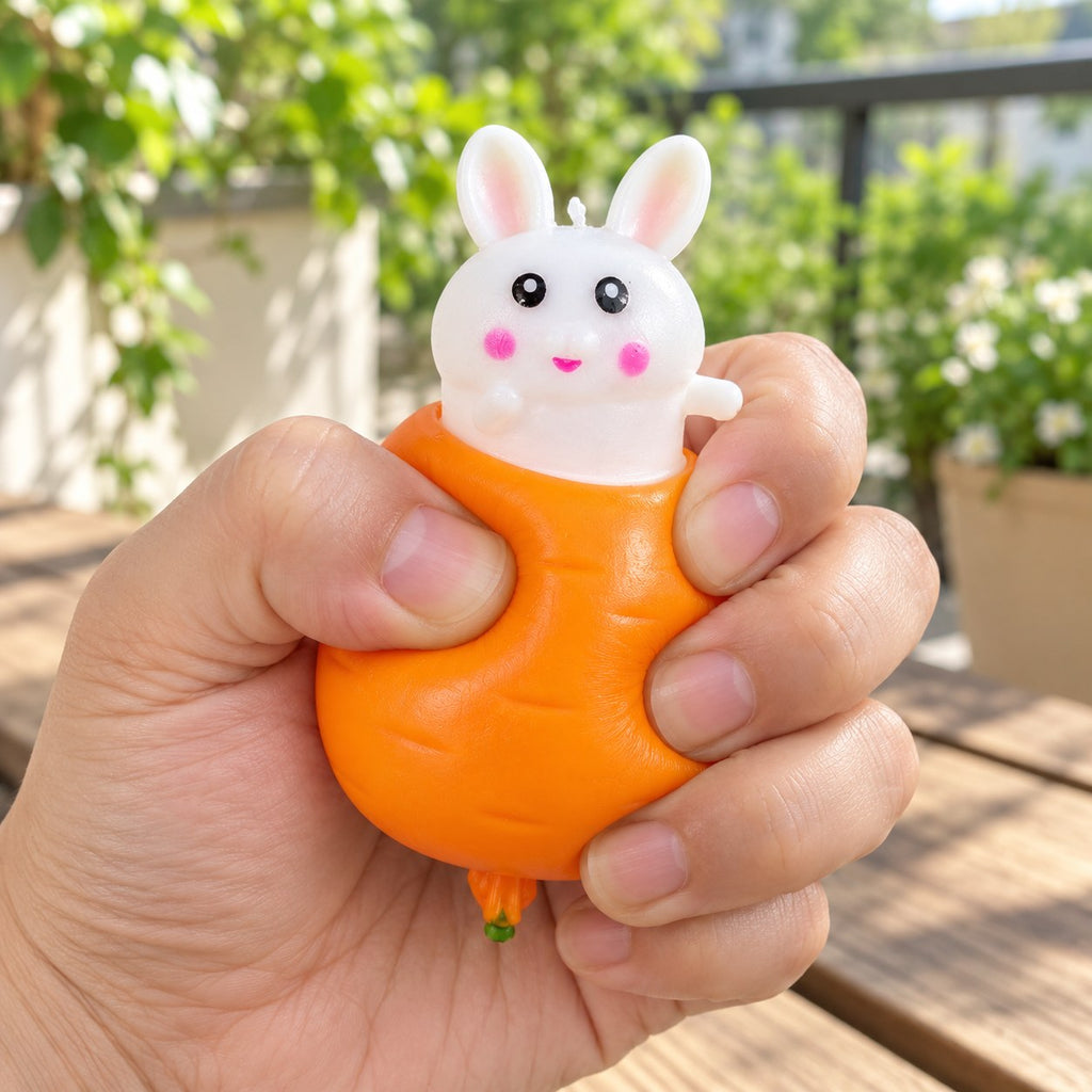Bunny Pop-Up Squishy, Rabbit in a Carrot, being squeezed by hand, soft and squishy