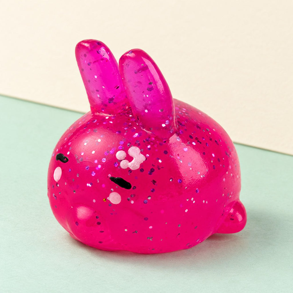 Bunny squishy mochi – Mochi Squishy Bunny with Glitter, product photo on pastel paper