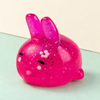 Bunny squishy mochi – Mochi Squishy Bunny with Glitter, product photo on pastel paper