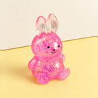 Bunny squishy stretchy – Bunny Squishy with Glitter, Sugar Style, product photo on pastel paper