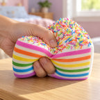 Jumbo Rainbow Cake Squishy, Layer Slice 15 cm (Rainbow sprinkles), being squeezed by hand, soft and squishy