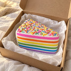 Jumbo Rainbow Cake Squishy, Layer Slice 15 cm (Rainbow sprinkles), unboxed from a parcel with tissue paper