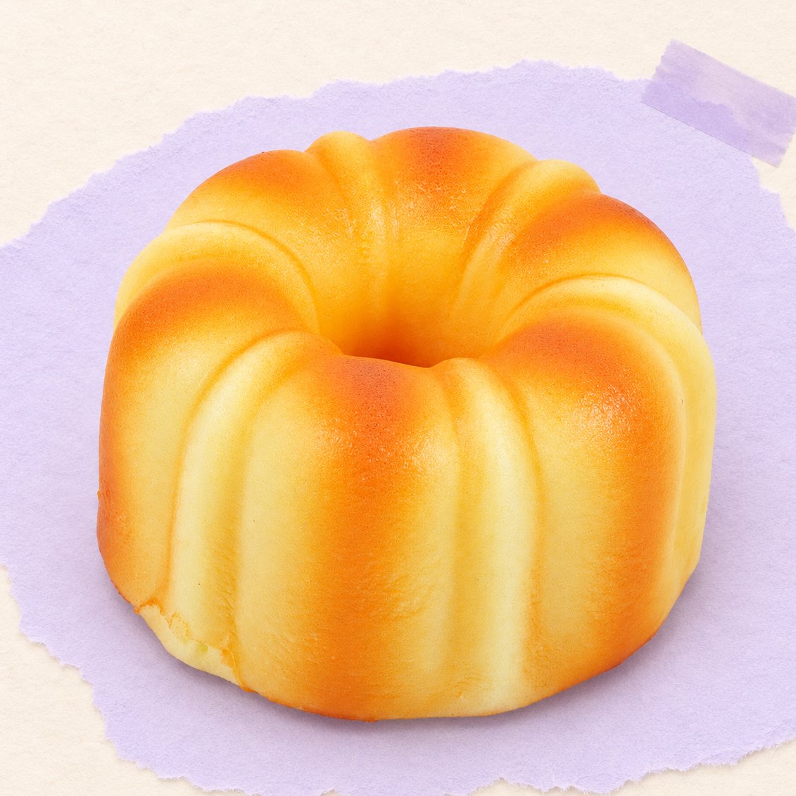 Canelé squishy, Frans gebakje van 9 cm, op pastelkleurig papier