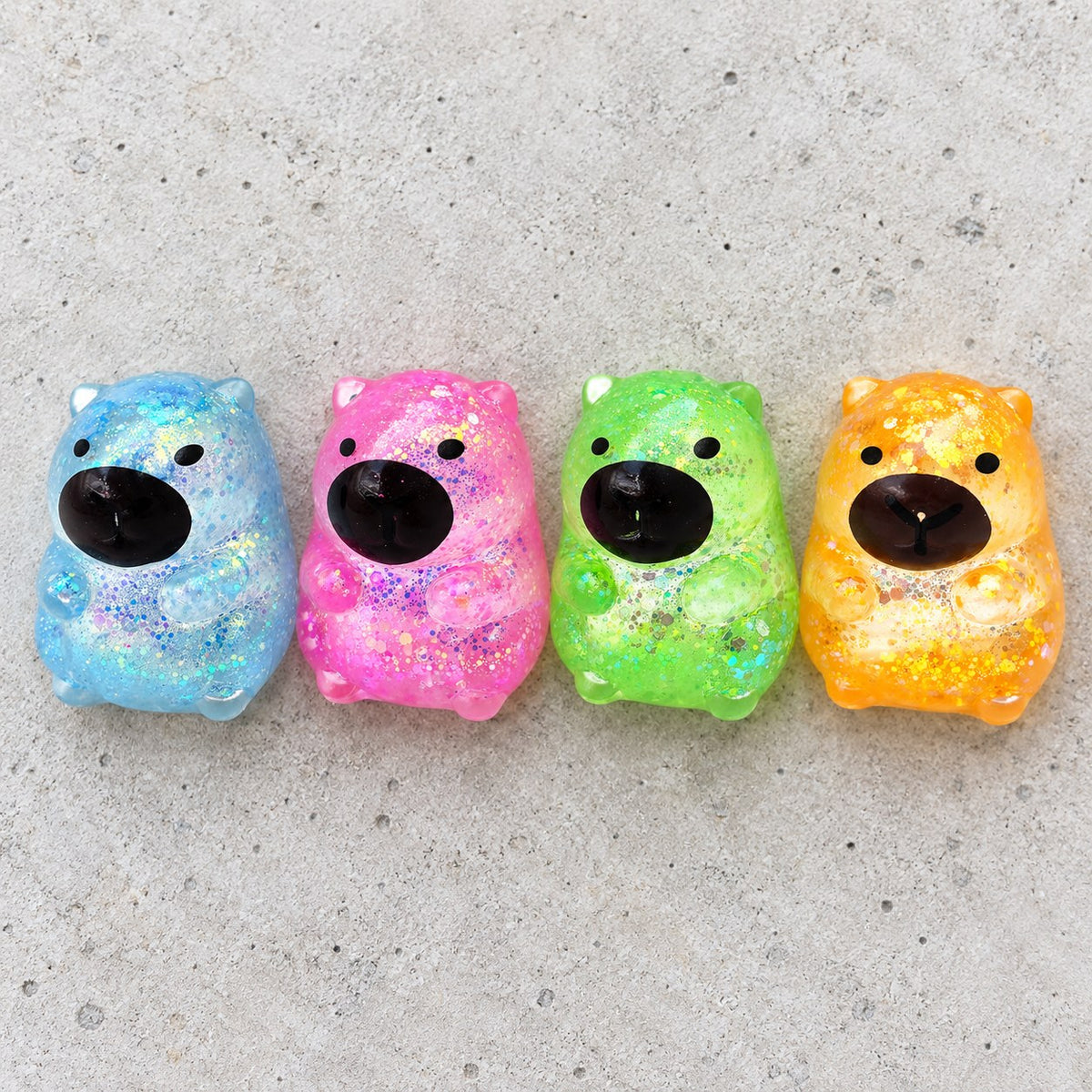 Capybara squishy with glitter, all colors side by side
