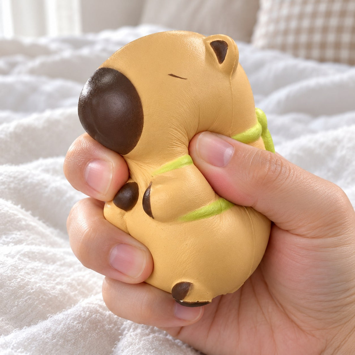 Capybara squishy kawaii (Turtle, light beige), being squeezed by hand, soft and squishy