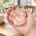 Cat paw squishy glitter jelly (Strawberry pink), held in a hand to show the real size