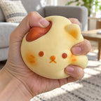 Cat bun squishy kawaii, being squeezed by hand, soft and squishy