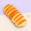 Caterpillar bread squishy slow rising – Caterpillar Bread Squishy, 15 or 21 cm (15 cm), product photo on pastel paper