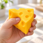 Cheese Wedge Squishy, Mini or Flour Finish (Wedge, Flour Finish), being squeezed by hand, soft and squishy
