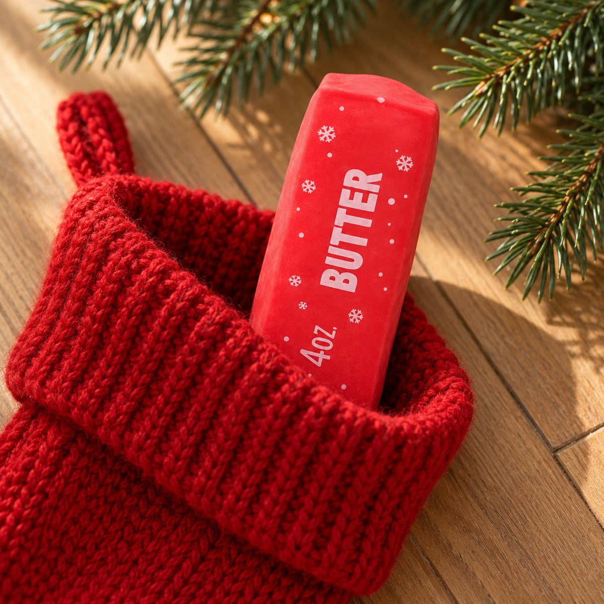 Christmas Butter Squishy, Crispy Stick in Gift Box (red), peeking out of a Christmas stocking