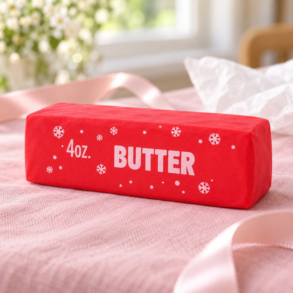 Christmas Butter Squishy, Crispy Stick in Gift Box (red), as a small gift next to a wrapped box