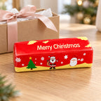 Christmas Butter Stick Squishy, Slow Rising (red), as a small gift next to a wrapped box