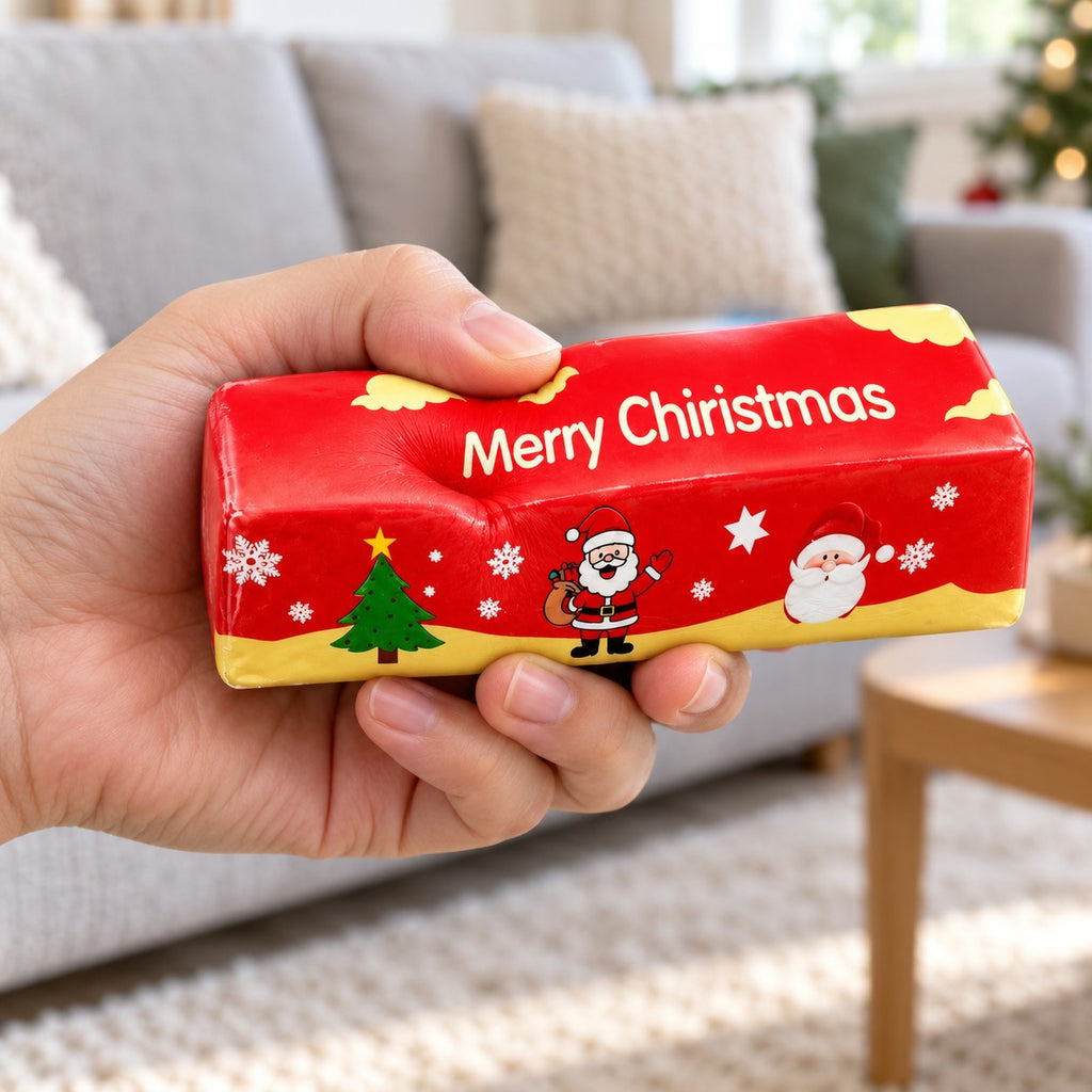 Christmas Butter Stick Squishy, Slow Rising (red), being squeezed by hand, soft and squishy