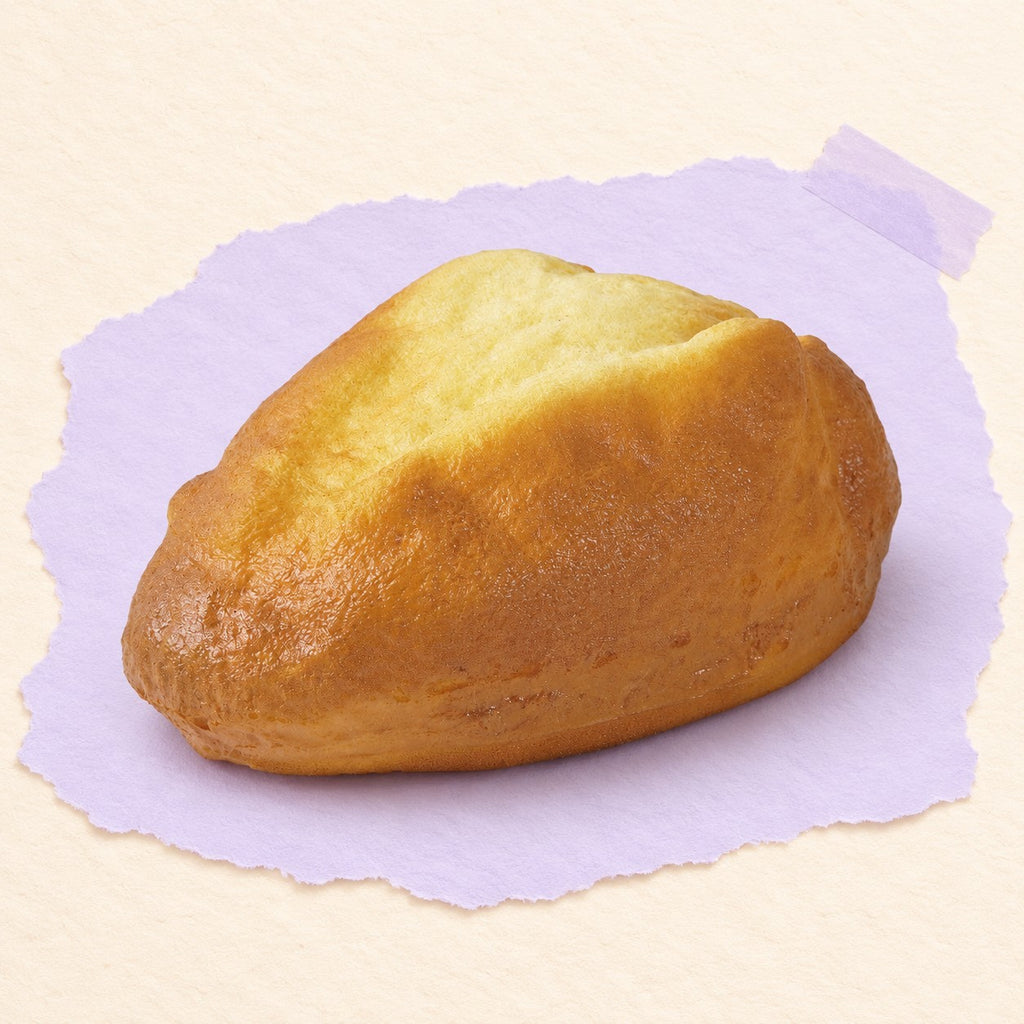 Country bread squishy slow rising – Country Bread Squishy, Golden Loaf 16 cm, product photo on pastel paper