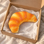 Croissant squishy slow rising (12.5 cm), unboxed from a parcel with tissue paper