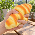 Croissant Squishy, Realistic Slow Rising Bread (16 cm), being squeezed by hand, soft and squishy