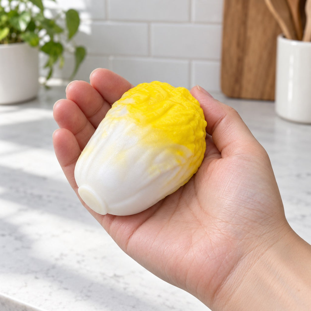 Crunchy Cabbage Squishy, Handmade (Yellow), held in a hand to show the real size