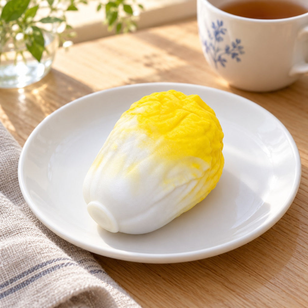 Crunchy Cabbage Squishy, Handmade (Yellow), on a plate on a breakfast table