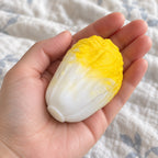 Crunchy Cabbage Squishy, Handmade (Yellow), held toward the camera, first-person view