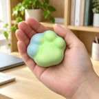 Crunchy Cat Paw Squishy, 6 cm (green), held in a hand to show the real size