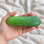 Crunchy Cucumber Squishy, Crispy PU Vegetable, held toward the camera, first-person view