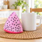 Crunchy Dragon Fruit Squishy, Changes Color in Sunlight, next to a coffee mug for size comparison