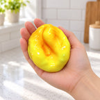 Fried dough squishy crunchy, held in a hand to show the real size