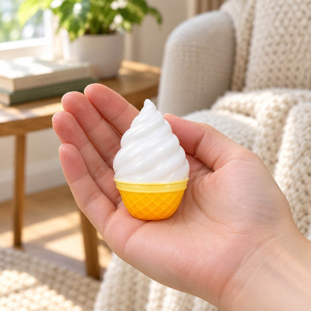 Crunchy Vanilla Ice Cream Squishy, Mini, held in a hand to show the real size