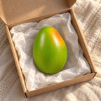 Mango squishy, unboxed from a parcel with tissue paper