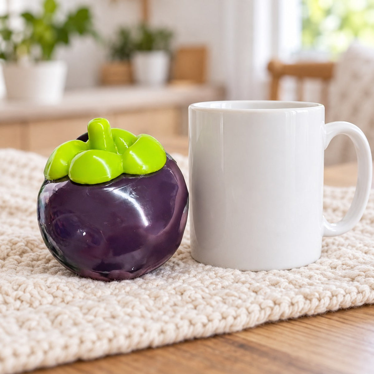 Mangosteen squishy, next to a coffee mug for size comparison