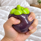Mangosteen squishy crunchy, being squeezed by hand, soft and squishy